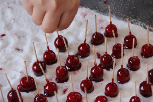 tray of candied cranberries on toothpicks