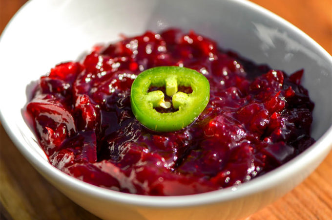 dish of cranberry sauce with hot pepper garnish