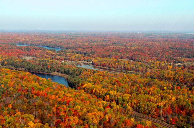 aerial photo of johnston's cranberry marsh with fall coloured forests