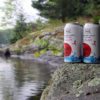 two cans of cliff jump cranberry cider from muskoka lakes
