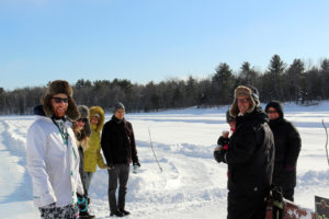 guide talking to a group of people outside in winter