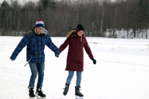 couple skating holding hands