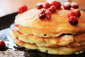 a stack of cranberry pancakes