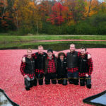 johnston family in cranberries at muskoka lakes farm & winery