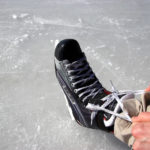 lacing up skates on the ice trail at muskoka lakes farm & winery in bala ontario