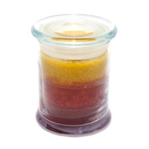 tri coloured candle in a glass jar