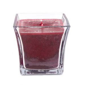 cranberry candle in a glass container