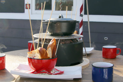 outdoor table set with cheese fondue