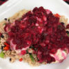 plate of chicken with cranberry salsa on a bed of rice