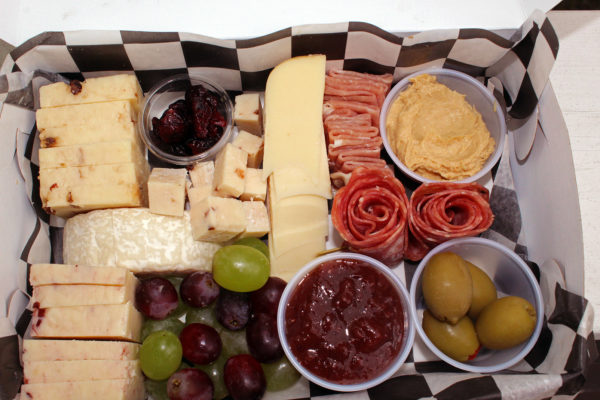 charcuterie box with cheese, meat, crackers