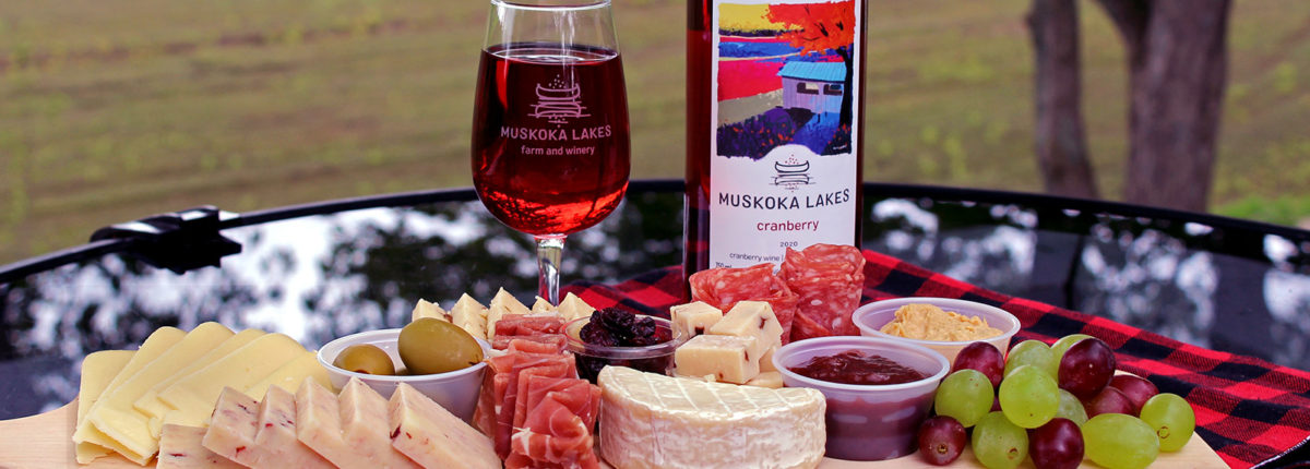 charcuterie spread with cheese, meat, crackers and wine