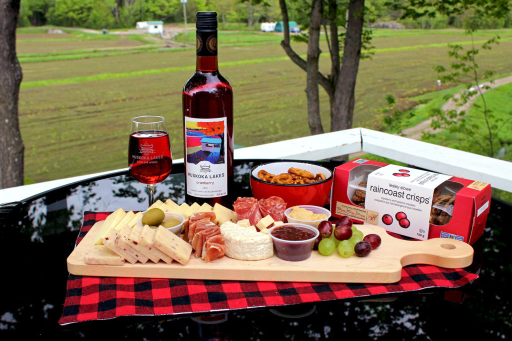 charcuterie spread with cheese, meat, crackers and wine
