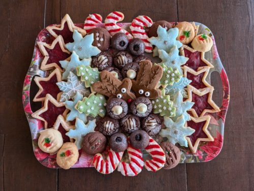 A photo of a festive tray filled with a variety of homemade Christmas cookies.