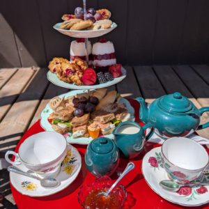 a demonstration of a fully prepared cranberry afternoon tea for two.